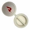 An open white plastic pill case has a red "R" logo on the lid and two compartments in the base.